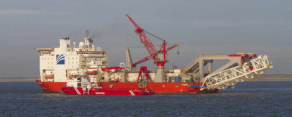 Nautical Vessel, Industrial Ship, Sea, Construction, Pipelay, Shipping, Crane, Shipyard, Harbor, Rotterdam, sub-sea, Commercial Dock, Dutch Culture, Technology, Red, Freight Transportation, Netherlands, J-lay, Boarding, Moored, International Landmark, Jet
